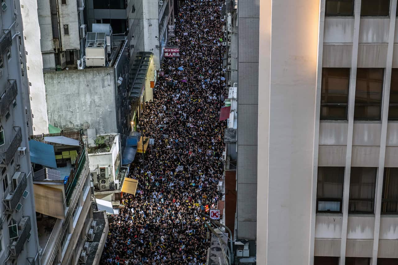 Protesters mass in the streets of Hong Kong on Monday, July 1, 2019. 