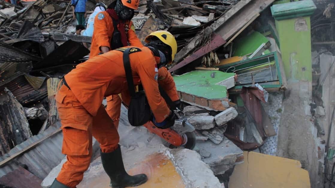 Indonesian rescuers searching for survivors at a collapsed house at Balaroa district in Palu, central Sulawesi, Indonesia.