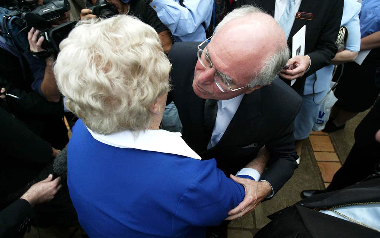 Lady Flo Bjelke-Petersen receives well wishes from then Prime Minister John Howard after the conclusion of the state funeral of her late husband (AAP)