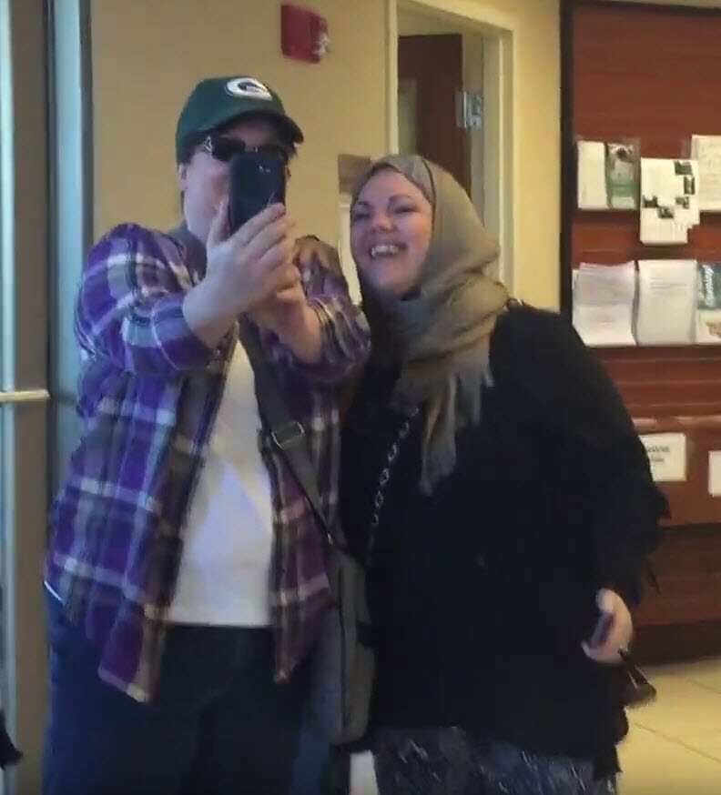 Anti-Islamic protester Annie takes a selfie inside the Noor Islamic Cultural Centre.