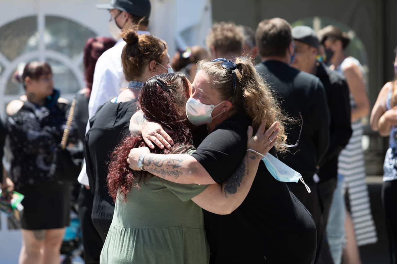 Friends and family are seen gathered for the funeral of Peter Dodt at the Mersey Gardens Chapel and Crematorium, in Devonport, Tasmania.