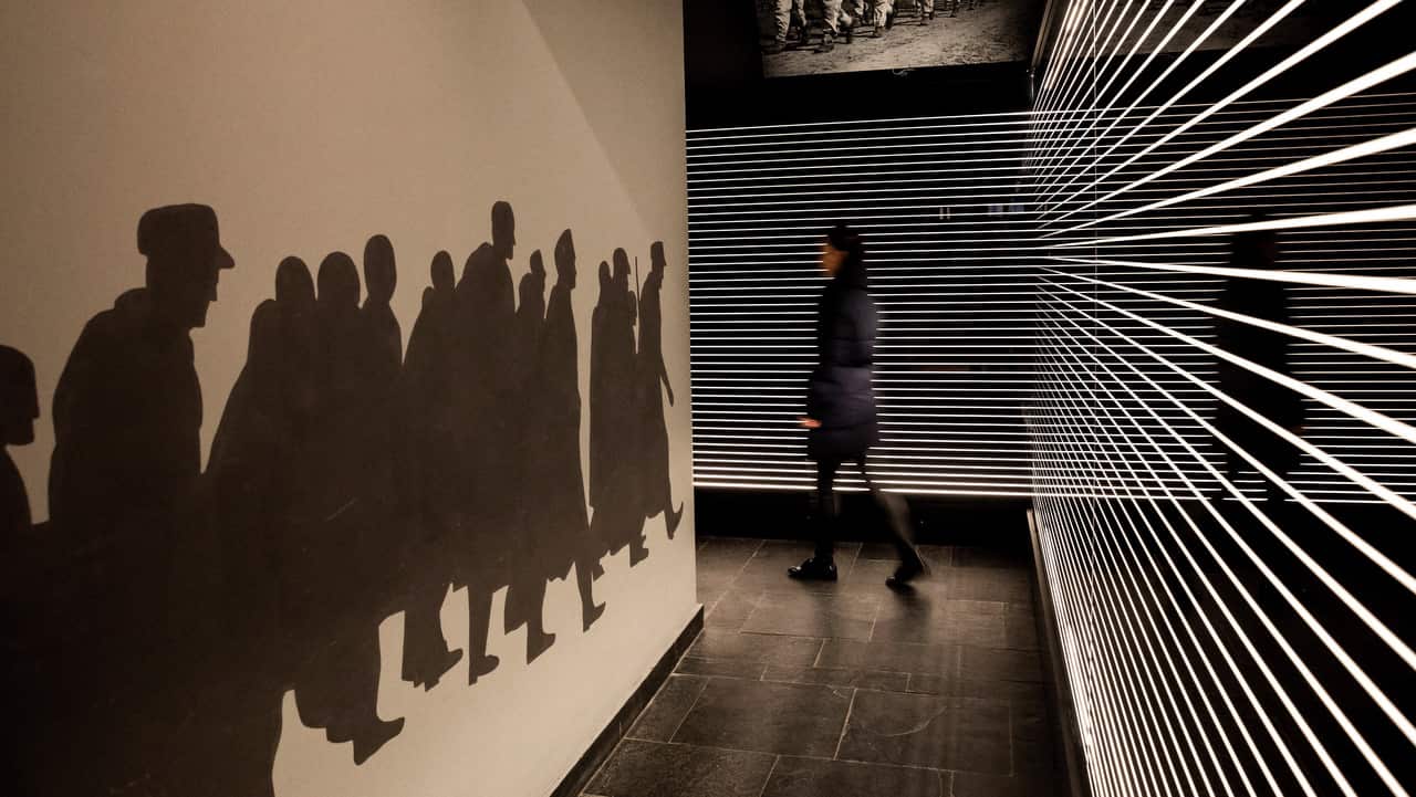 A visitor walks on a corridor of the Holocaust Memorial Center.
