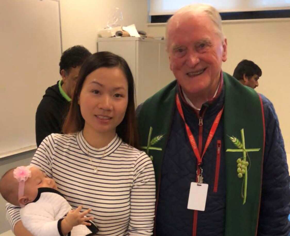 Huyen with Father Peter Carrucan