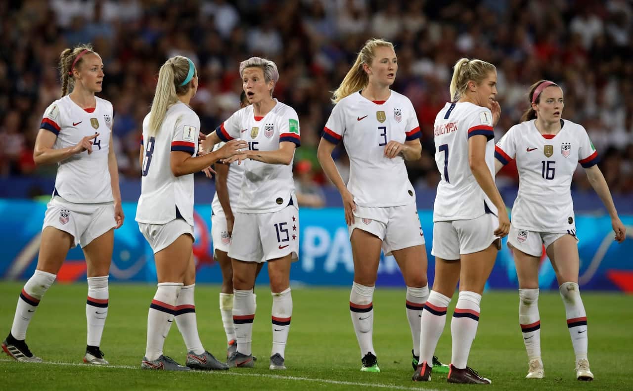 United States' Megan Rapinoe, third right, reacts with teammate Julie Ertz during the Women's World Cup quarterfinal soccer match between France and the United States 
