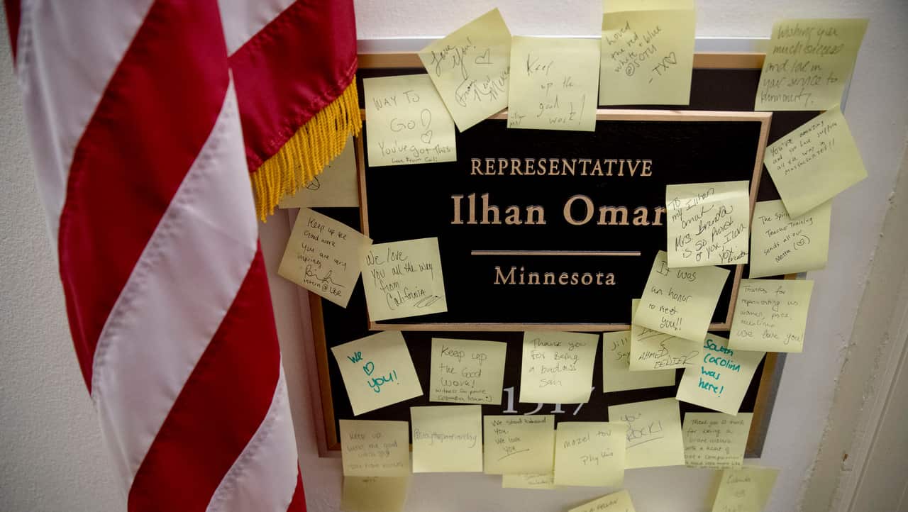 People leave post-it notes of support outside the office of Democratic congresswoman Ilhan Omar.