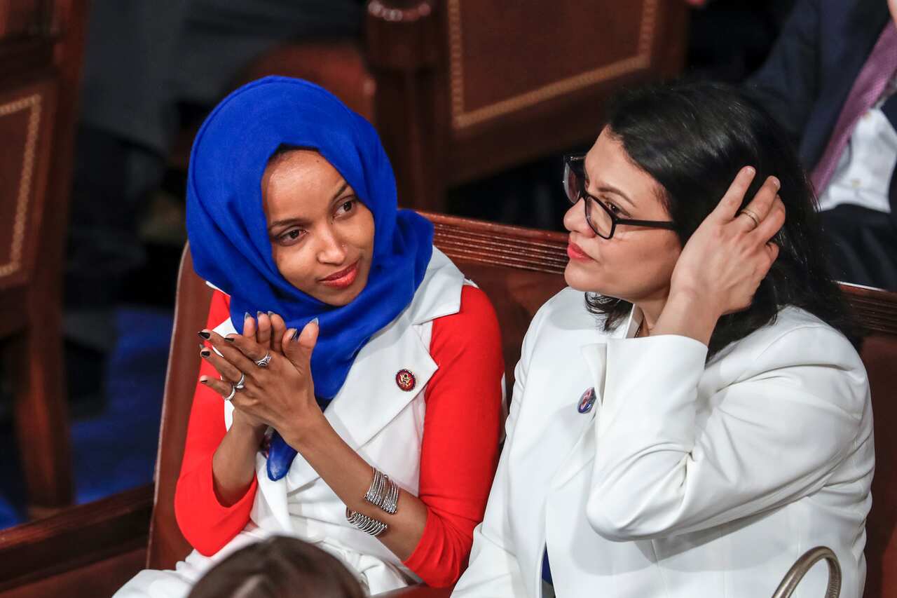 Ilhan Omar and Rashida Tlaib listen to President Trump's state of the union speech (AAP)