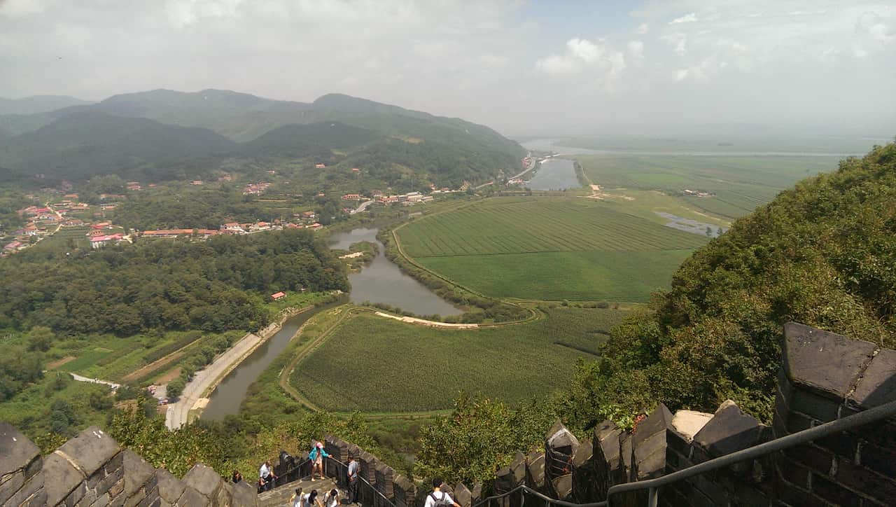 Picture taken from the top of the Great Wall in Dandong, looking down at the Yalu river. On the left is China, and North Korea is on the right. (Image: Elle Hardy)