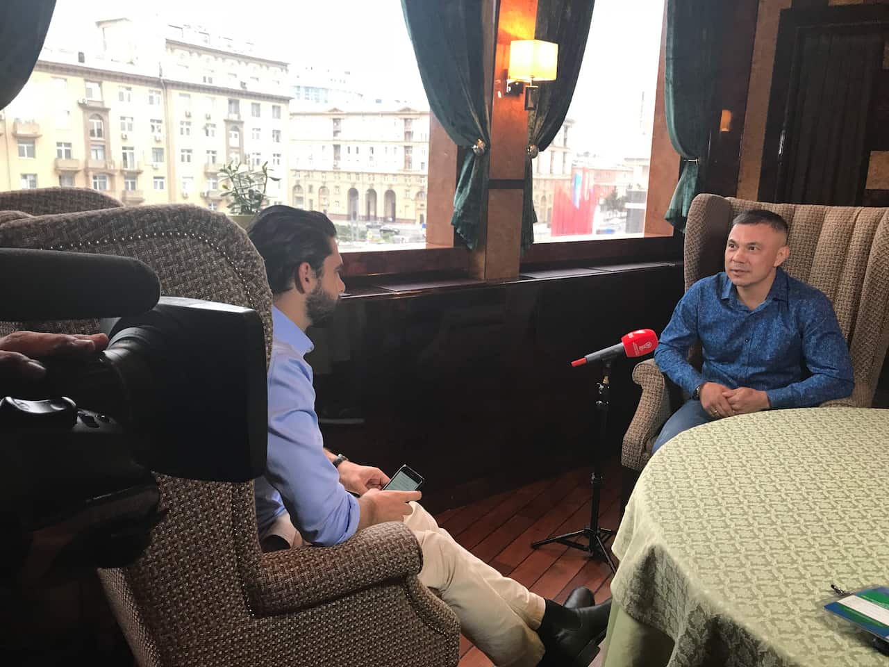 Russian- Australian boxing legend, Kostya Tszyu (right), speaks with SBS reporter Darren Mara in Russia.