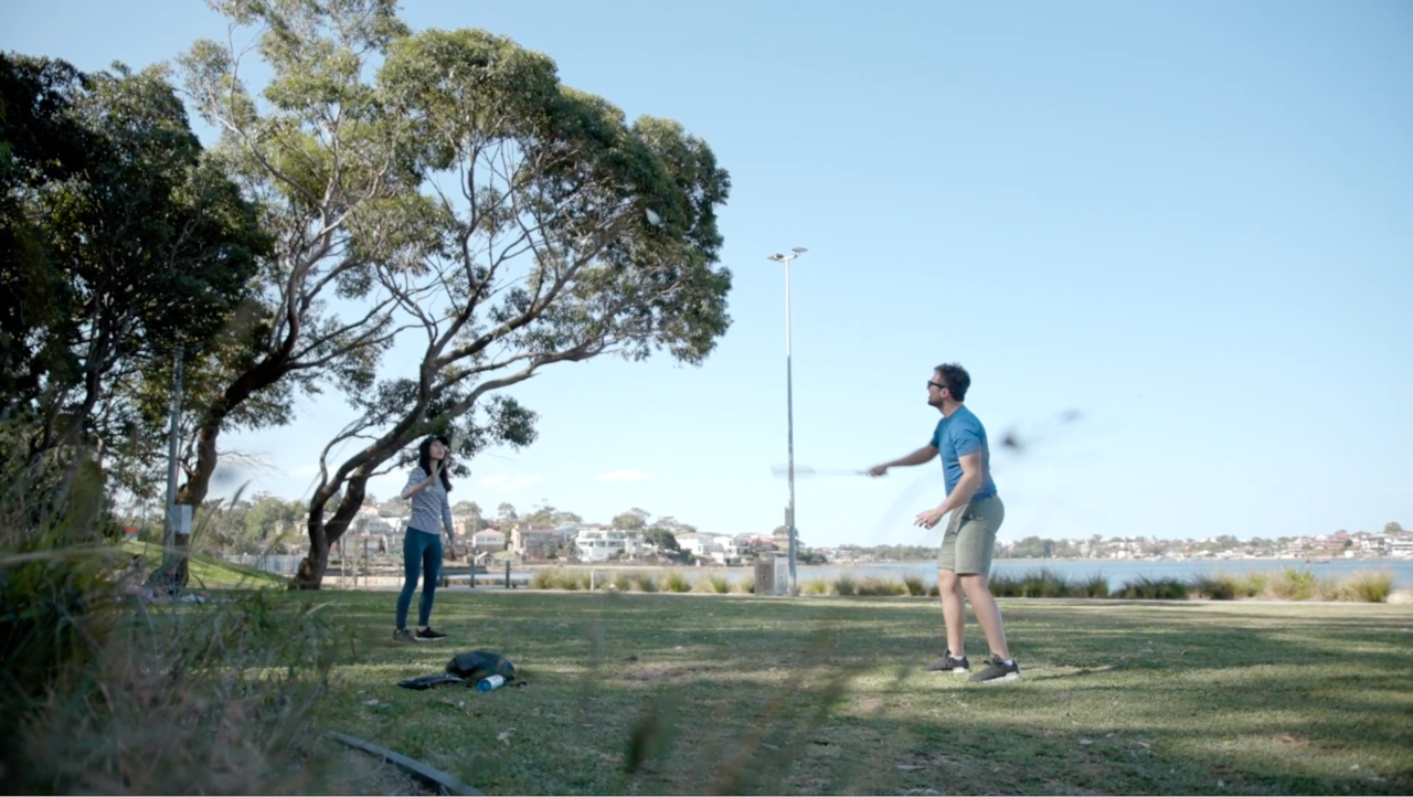 Queenie and her partner Pablo playing badminton in the park 