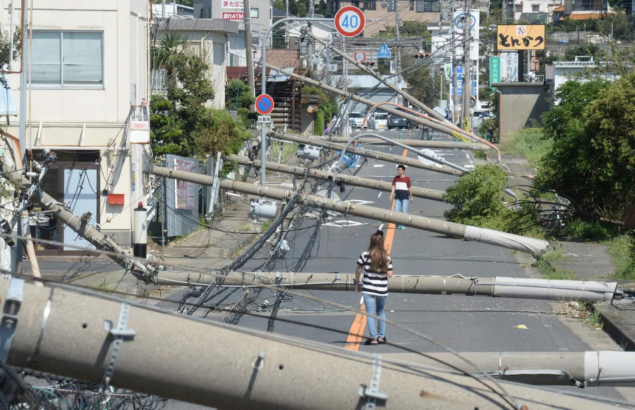 Utility poles collapse due to the typhoon Jebi in Sennan City, Osaka Prefecture on September 5, 2018. Life-threatening typhoon Jebi made a landfall