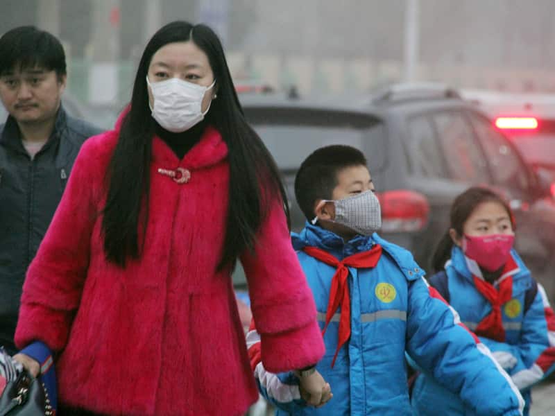 Chinese parents escort their children to school in the Hebei province