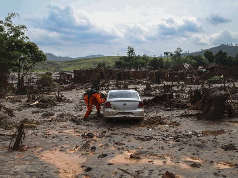 Firefighters search for victims after a Brazilian mining accident