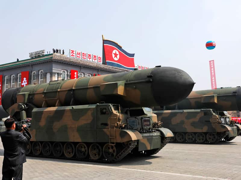 North Korean military vehicles carrying missiles during a parade