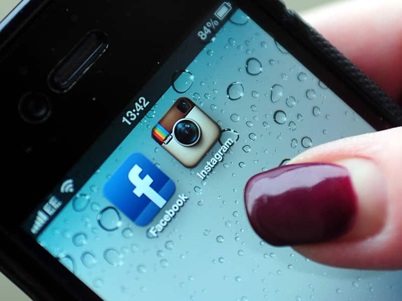 Instagram and Facebook logos on a smartphone