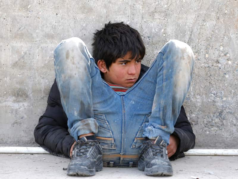 A Syrian refugee boy near Oncupinar border gate in Kilis city, Turkey