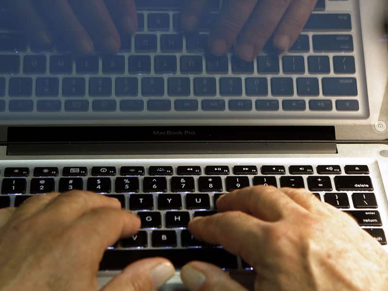 A person using a laptop computer