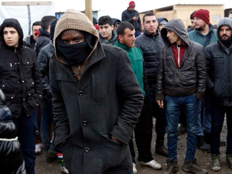 Migrants at a makeshift camp outside Calais