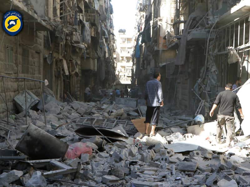 Syrians inspect damaged buildings after airstrikes hit Aleppo