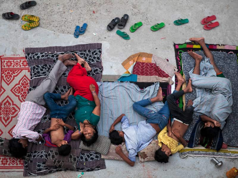 A family sleeps on the roof of a house in New Delhi