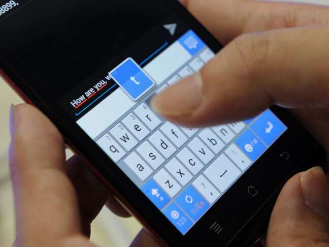 Someone typing on a mobile phone