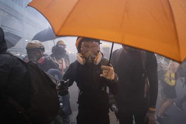 Hong Kong Bans Face Masks at Protests, and Masked Crowds Protest the Ban