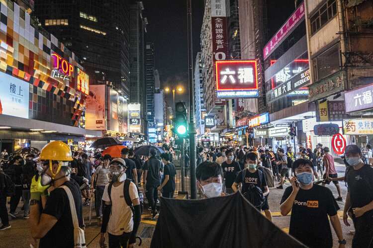 Protesters besiege Hong Kong after rally near US consulate.
