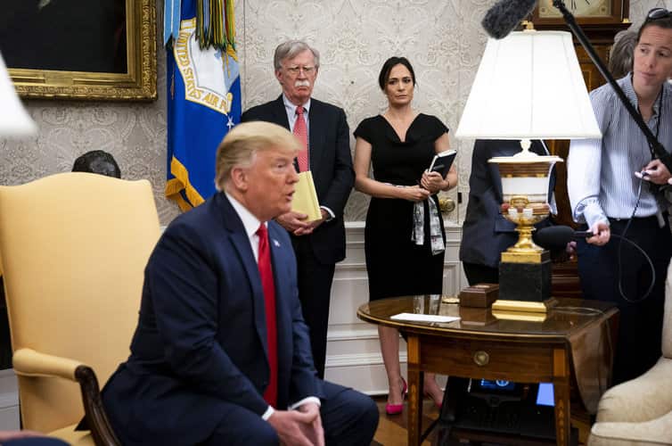 White House spokesperson Stephanie Grisham (back) has dismissed the report. 