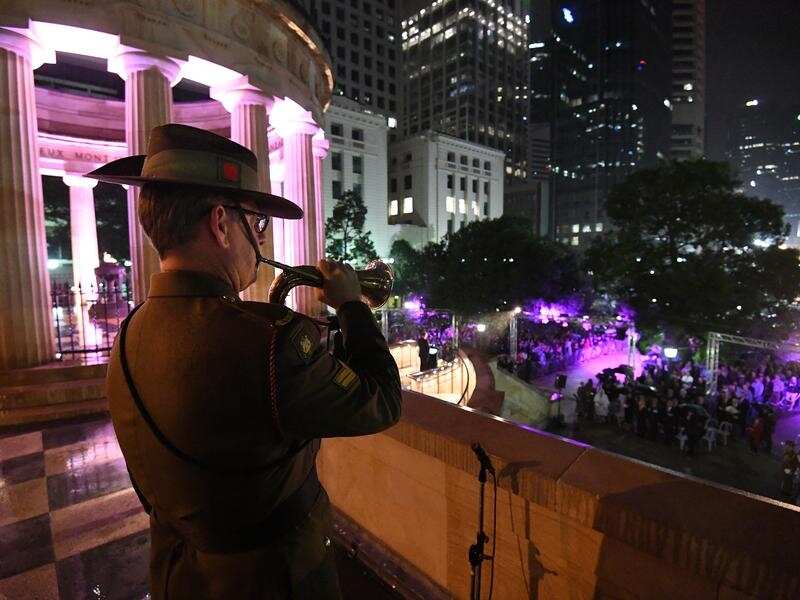 Bugler Aaron Madden during the Anzac Day dawn service in Brisbane.