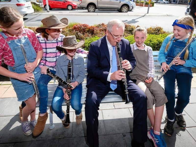 Scott Morrison plays a clarinet with students in Albury in September.