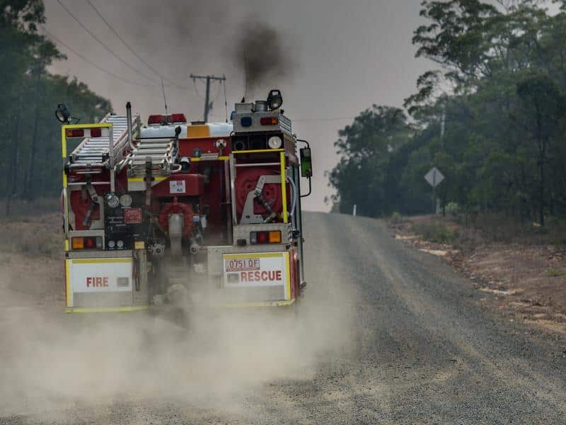A hundred firefighters from NSW have arrived to reinforce exhausted Queensland crews.