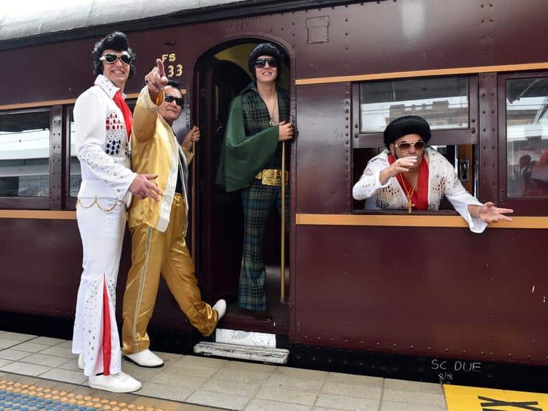 Elvis impersonators board the Blue Suede Express
