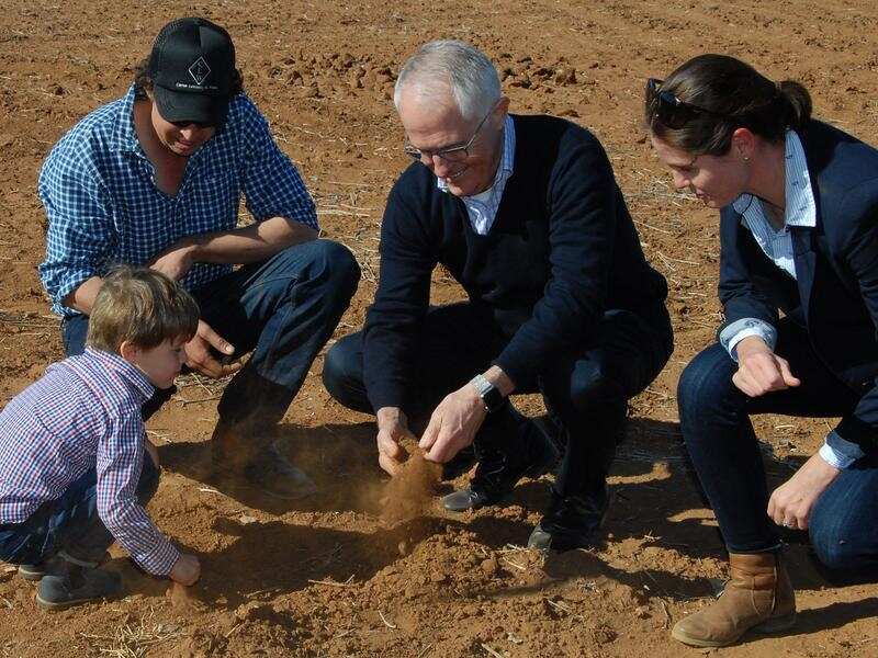 Malcolm Turnbull, farmer Phillip Miles, his wife Ashley
