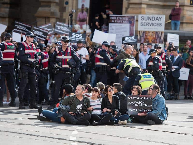 Animal rights protesters were arrested after blocking a major Melbourne CBD intersection.