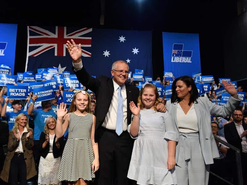 Prime Minister Scott Morrison with daughters Abbey, Lily and wife Jenny at Sunday's campaign rally. 