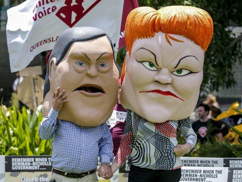 Protestors dressed as caricatures of Tim Nicholls and Pauline Hanson.