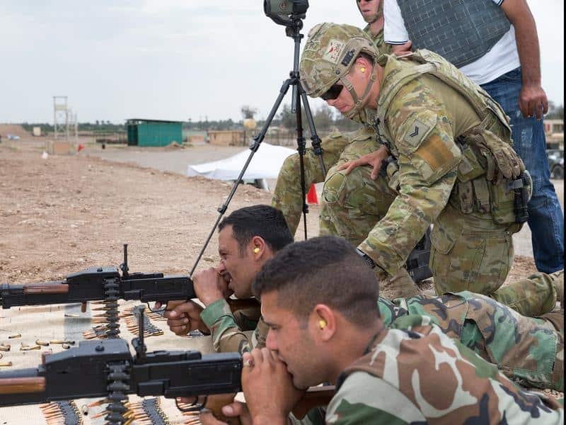 An Australian Army corporal assists in training Iraqi security forces.