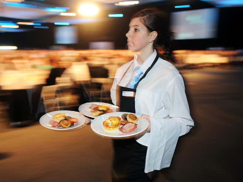 A waitress delivers food
