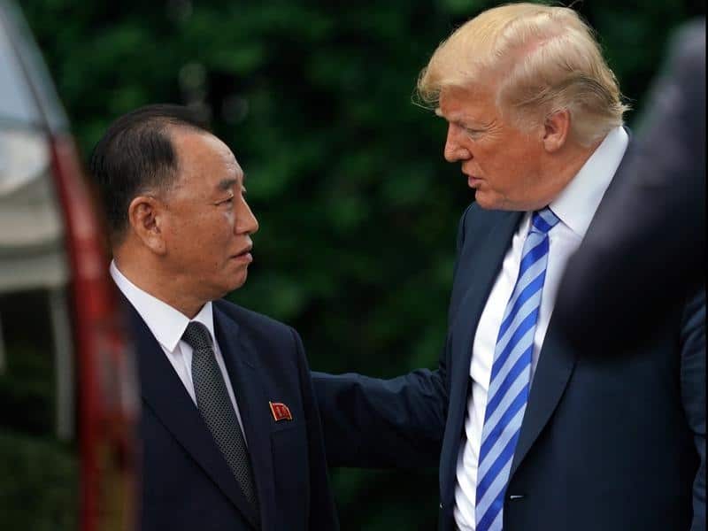 President Donald Trump talks with Kim Yong-chol