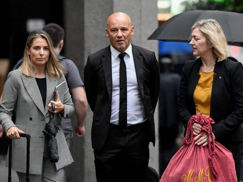 Former detective Gary Jubelin and his lawyers leave court. 