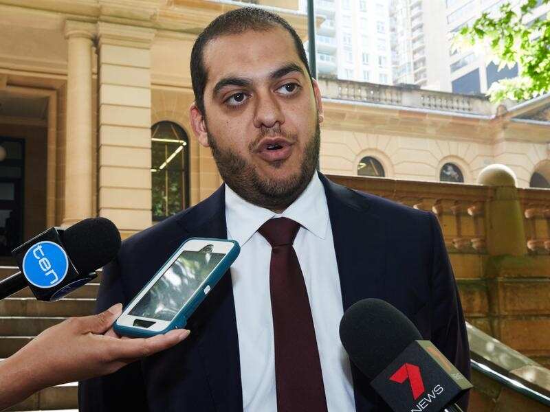 Mohamed Nizamdeen's lawyer Moustafa Kheir talks to media outside court