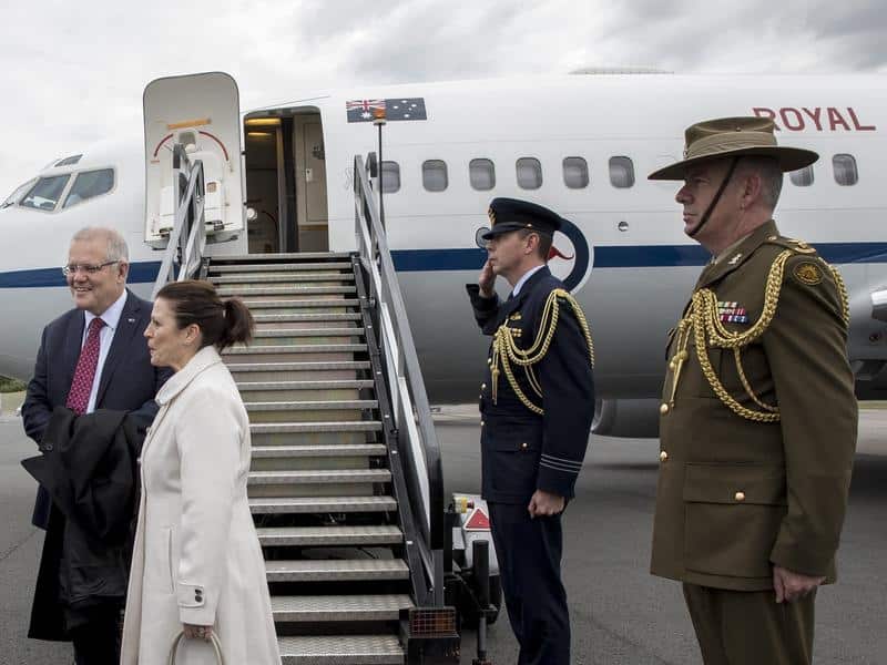 Scott Morrison arrives in London with his wife Jenny