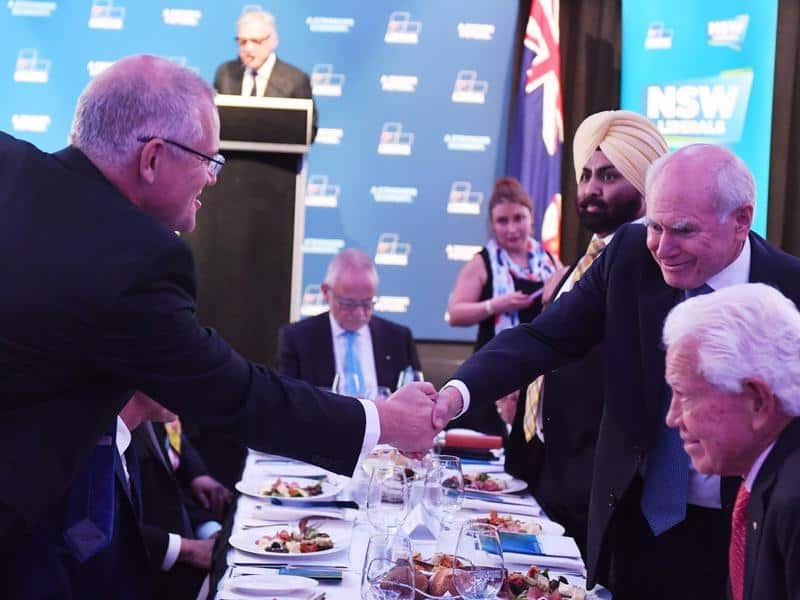 Scott Morrison shakes hands with former prime minister John Howard
