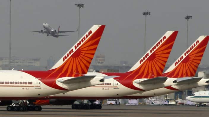 Three Air India planes on a tarmac