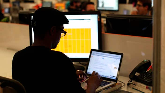 a man working in a dimly lit room