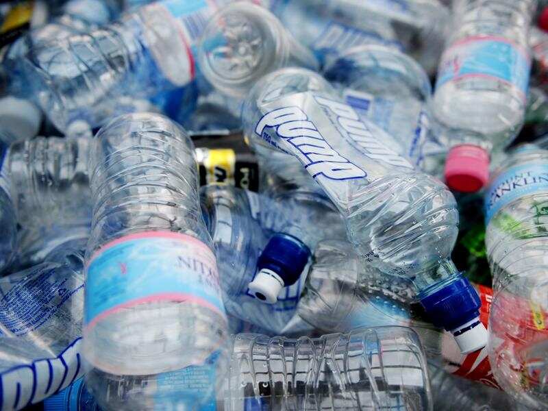 File image of empty plastic bottles packed inside a shopping trolley.
