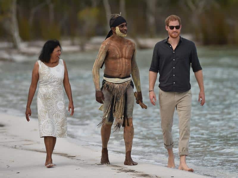 Britain's Prince Harry walks down the beach.