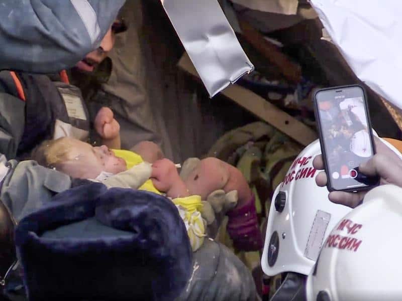 A 10-month-old baby boy has been pulled alive from the rubble of a collapsed Russian building.