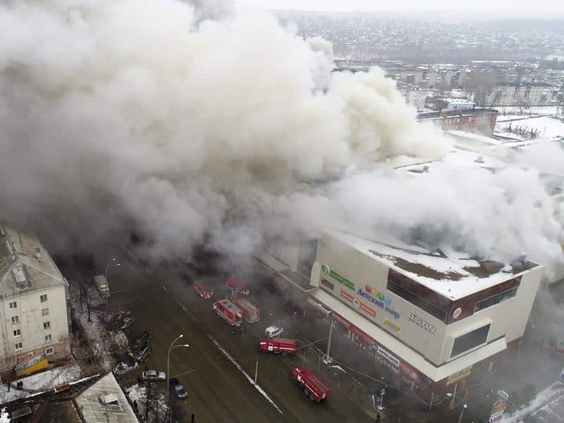 Smoke billows from the shopping centre in Kemerovo