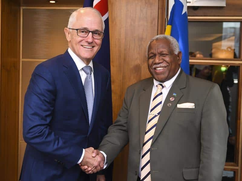Malcolm Turnbull and Solomons PM Rick Houenipwela shake hands.