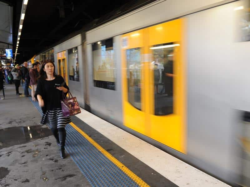 Passengers board a train at Circular Quay in Sydney